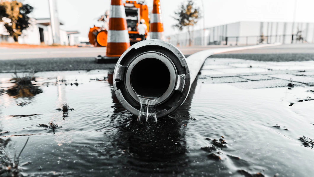 gray-pipe-with-water-coming-out-its-hole_181624-4705